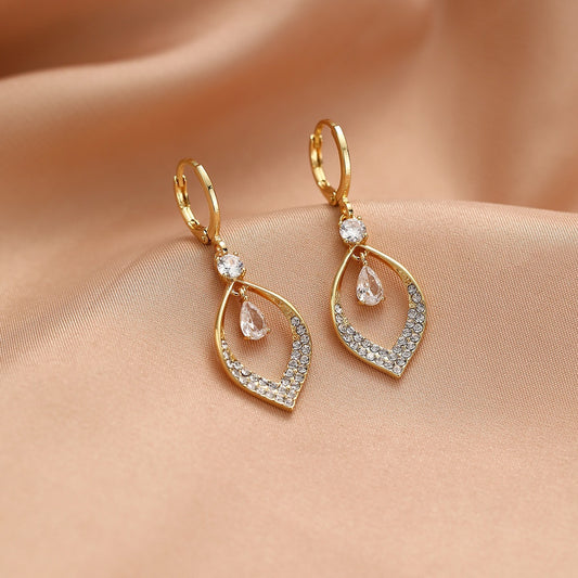 A Woman With Elegant Zircon Water Drop Tassel Earrings